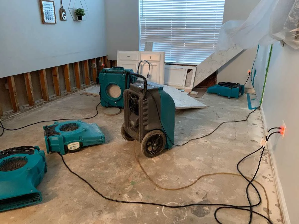 Dehumidifier in flood-cut room for Water Damage Restoration in Burke